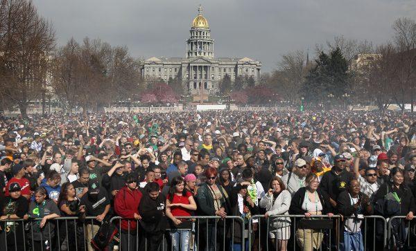 Marijuana smoke rises from a smoking crowd at a pro-pot "4/20" celebration in front of the state capitol building in Denver on April 20, 2010. (John Moore/Getty Images)