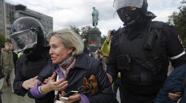 Police officers detain a protestor during an unsanctioned rally in the center of Moscow, Russia, on Aug. 3, 2019. (Pavel Golovkin/AP Photo)