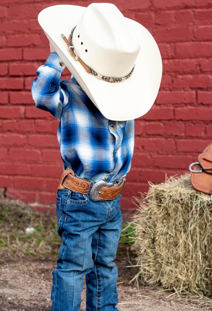 Illustration - Shutterstock | <a href="https://www.shutterstock.com/image-photo/little-kid-cowboy-hay-bell-1379957981">Jenniestanley</a>