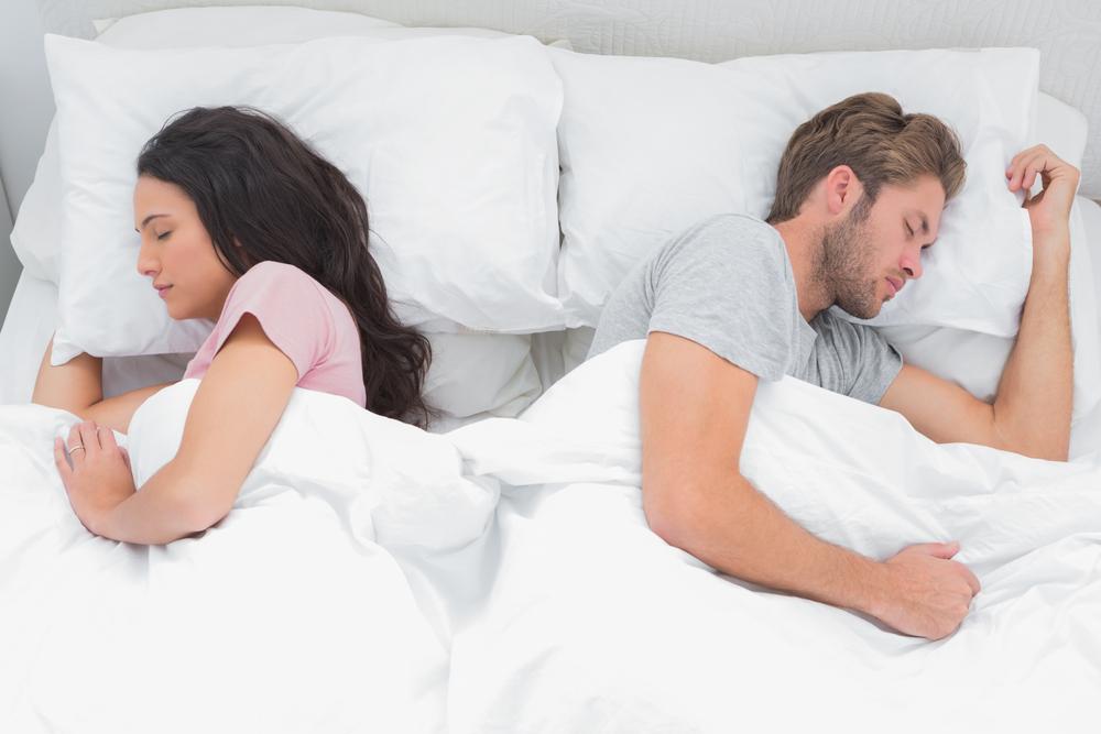 Illustration - Shutterstock | <a href="https://www.shutterstock.com/image-photo/beautiful-couple-sleeping-back-their-bed-143677840">wavebreakmedia</a>
