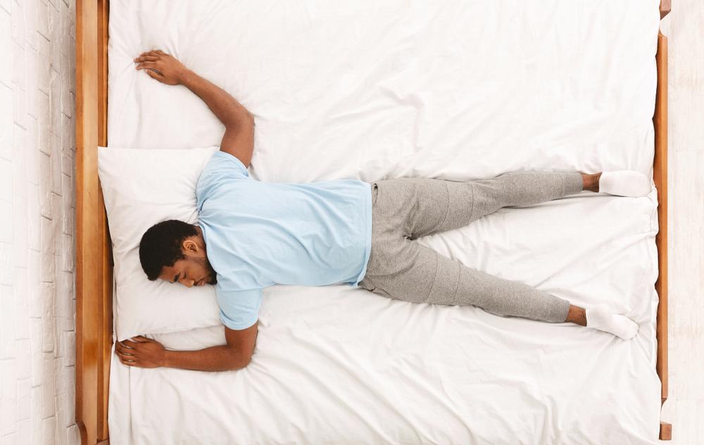 Illustration - Shutterstock | <a href="https://www.shutterstock.com/image-photo/favorite-pose-sleep-african-american-millennial-1371562664">Prostock-studio</a>