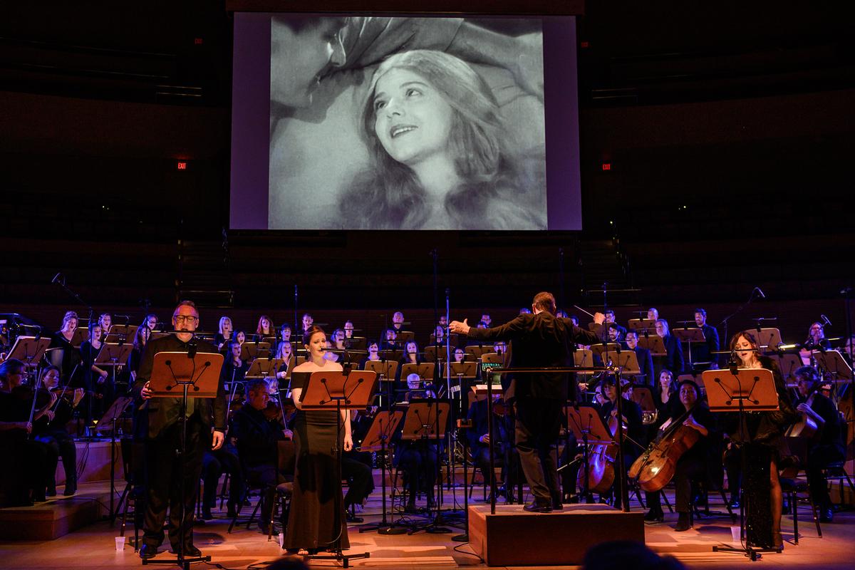 Settling an Old Score: A Song of Two Humans