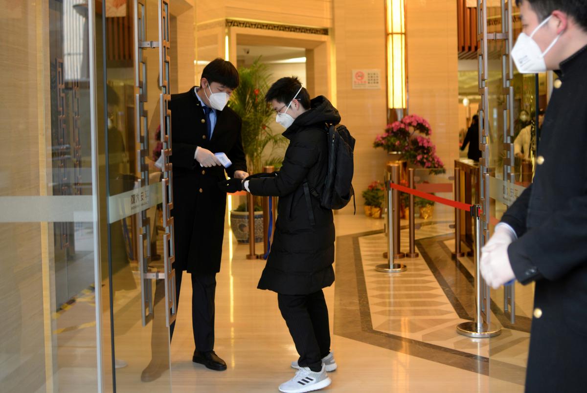Solo Lunches and Masks: Chinese Returning to Work Grapple With Coronavirus