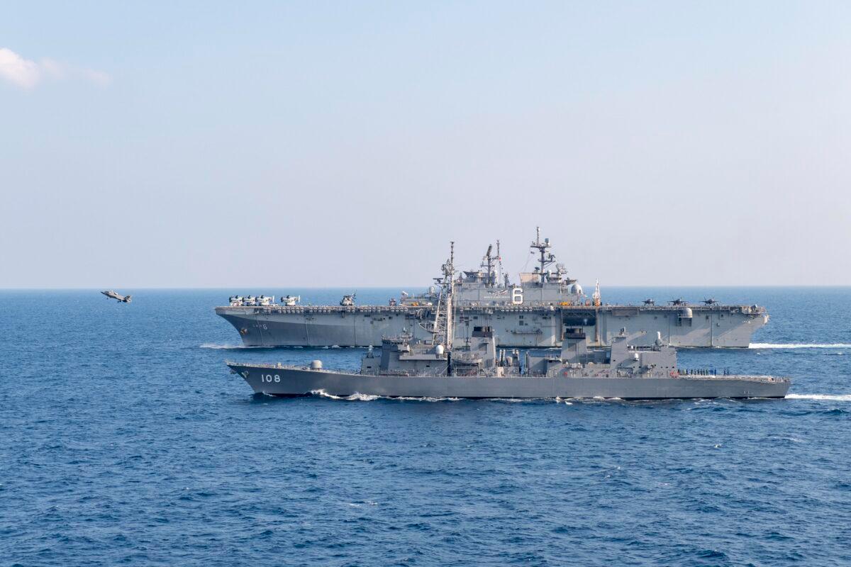 The amphibious assault ship USS America (LHA 6) launches an F-35B Lightning II assigned to the 31st Marine Expeditionary Unit, while sailing in formation with the Japan Maritime Self-Defense Force JS Akebono during exercises on April 9-11, 2020. (U.S. Navy/Mass Communication Specialist Seaman Jomark A. Almazan)