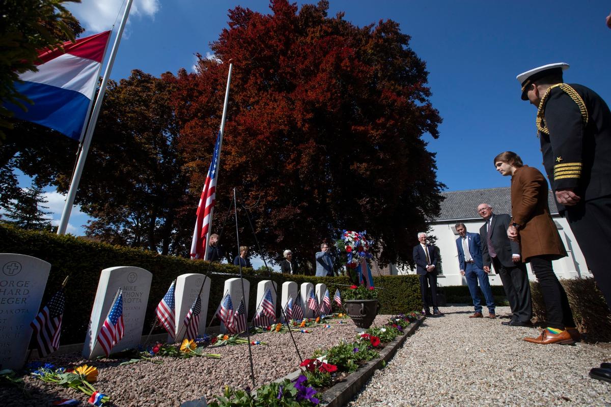 Volunteers Put Faces to Names of Americans in WWII Cemetery