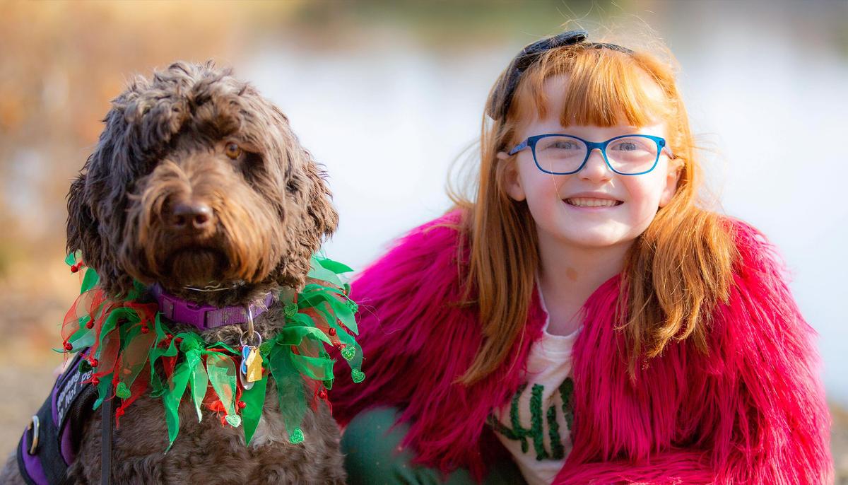 School Surprises 7-Year-Old With a Photo of Her Life-Saving Service Dog in the Yearbook