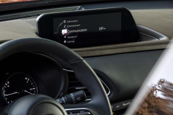 Minimalist dash with the infotainment screen. (Courtesy of Mazda)