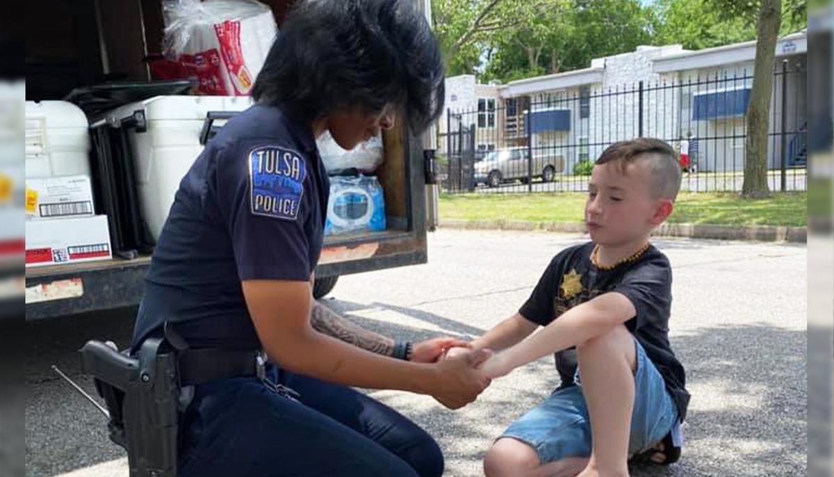 7-Year-Old Boy Prays With Local Police Officers Amid Protests, His ‘Mission’ Goes Viral
