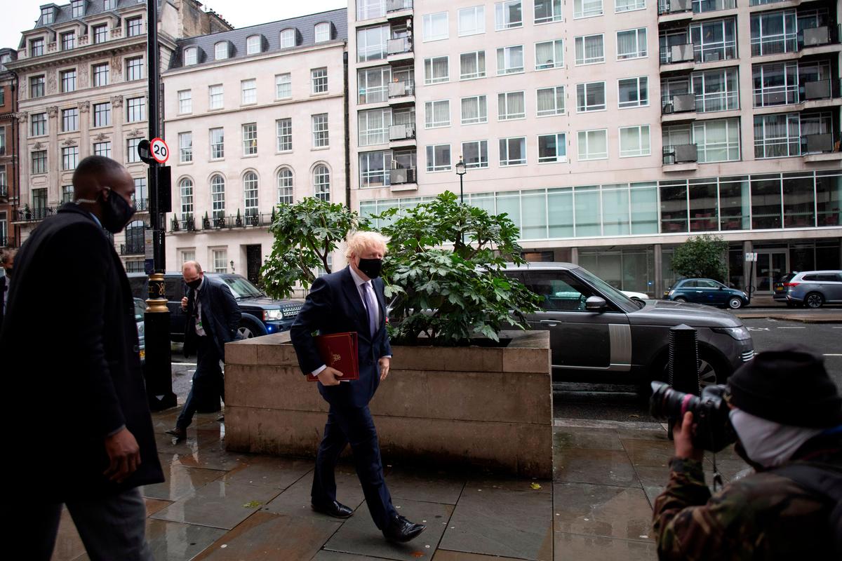 UK’s Johnson Defends Virus Strategy as Infections Soar