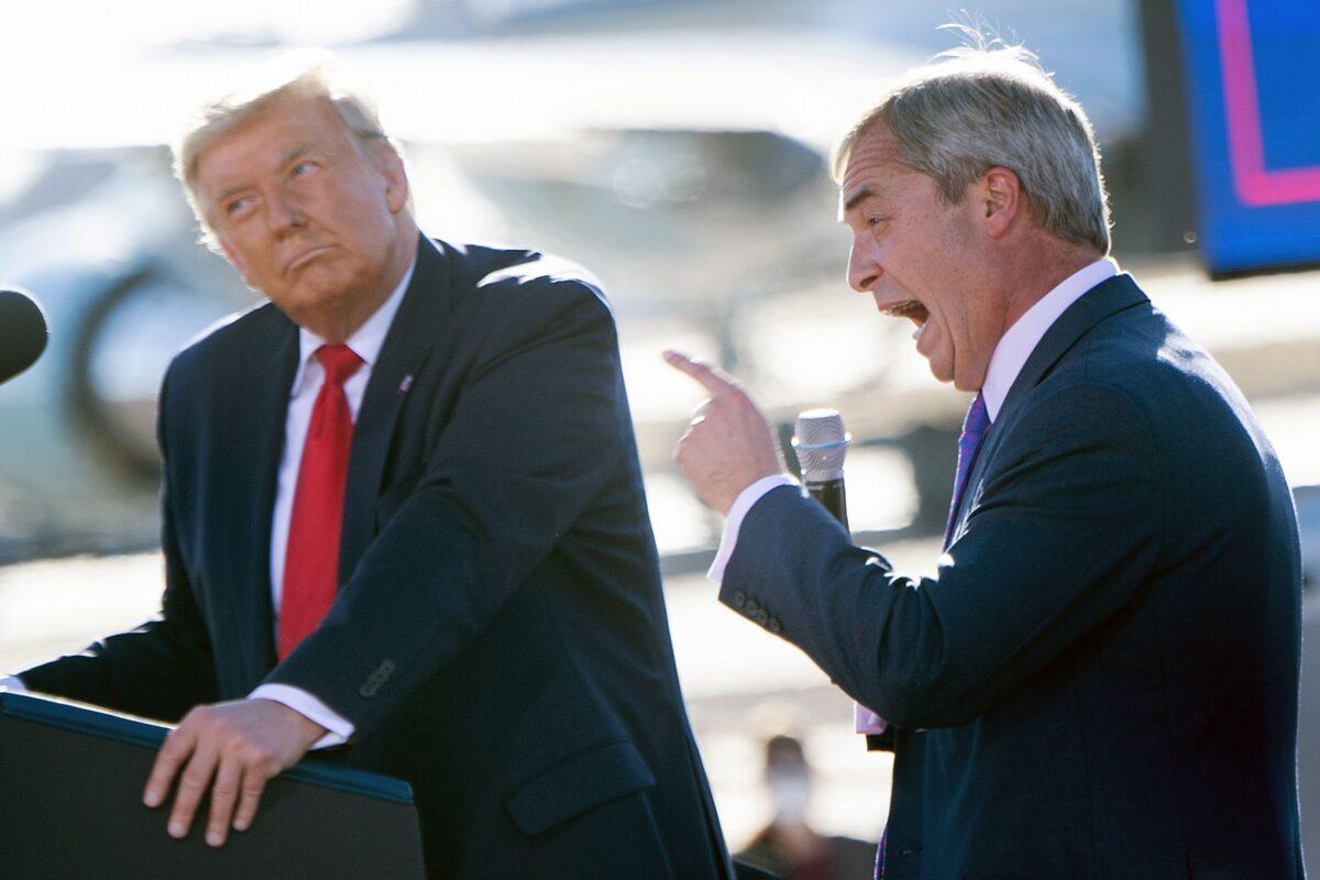 U.S. President Donald Trump listens as Nigel Farage (R) speaks during a Make America Great Again rally at Phoenix Goodyear Airport on Oct. 28, 2020, in Goodyear, Ariz. (Brendan Smialowski/AFP via Getty Images)