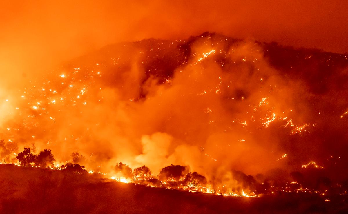 Californians Flee as Strong Winds Push Fire Through Canyons
