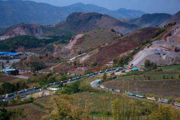 Food trucks wait to enter China near Muse, close to the Chinese border in Shan state, Burma, on April 20, 2020. (PHYO MAUNG MAUNG/AFP via Getty Images)