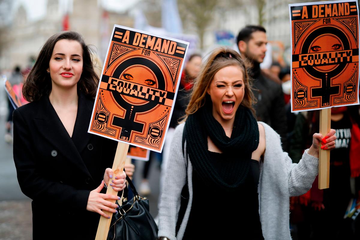 Demonstrators attend the "March4Women" during the International Women's Day in London on March 8, 2020. - Many feminist groups held online campaigns instead of street marches, using hashtags such as #FemaleStrike, #PowerUp and #38InternationalWomensDay to raise awareness of gender inequality. (Tolga Akmen/AFP via Getty Images)