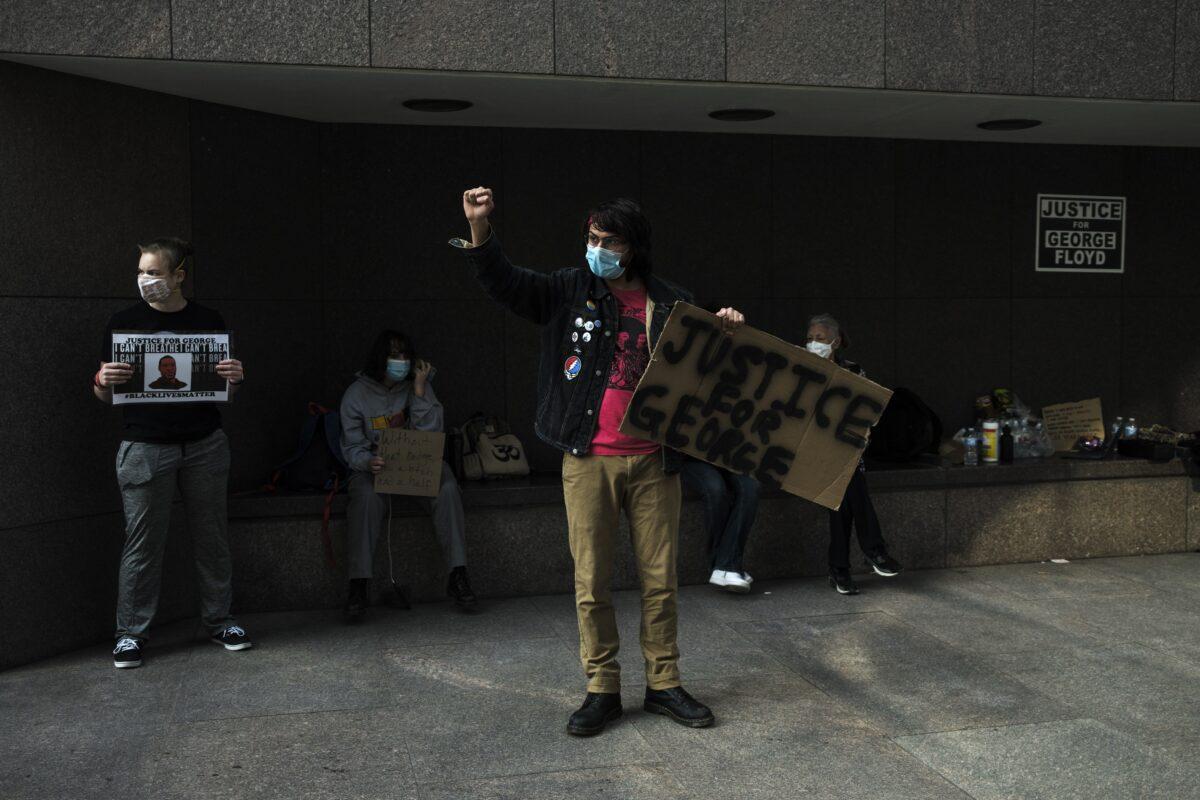 People demonstrate outside the Hennepin County Government Center in Minneapolis, Minn., on March 9, 2021. (Stephen Maturen/Getty Images)