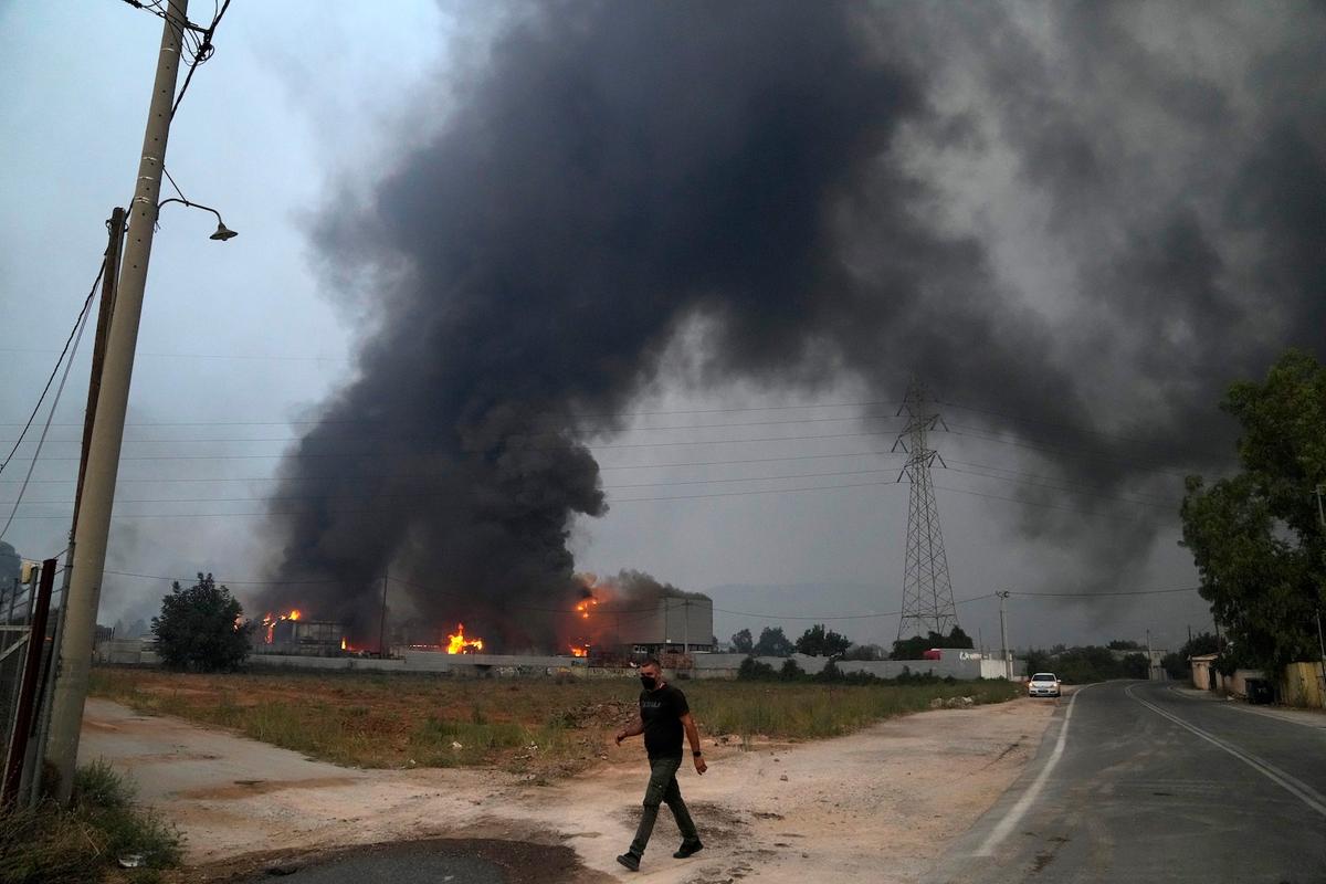 Thousands Flee Greece’s Capital as Wildfires Rage Through Mediterranean
