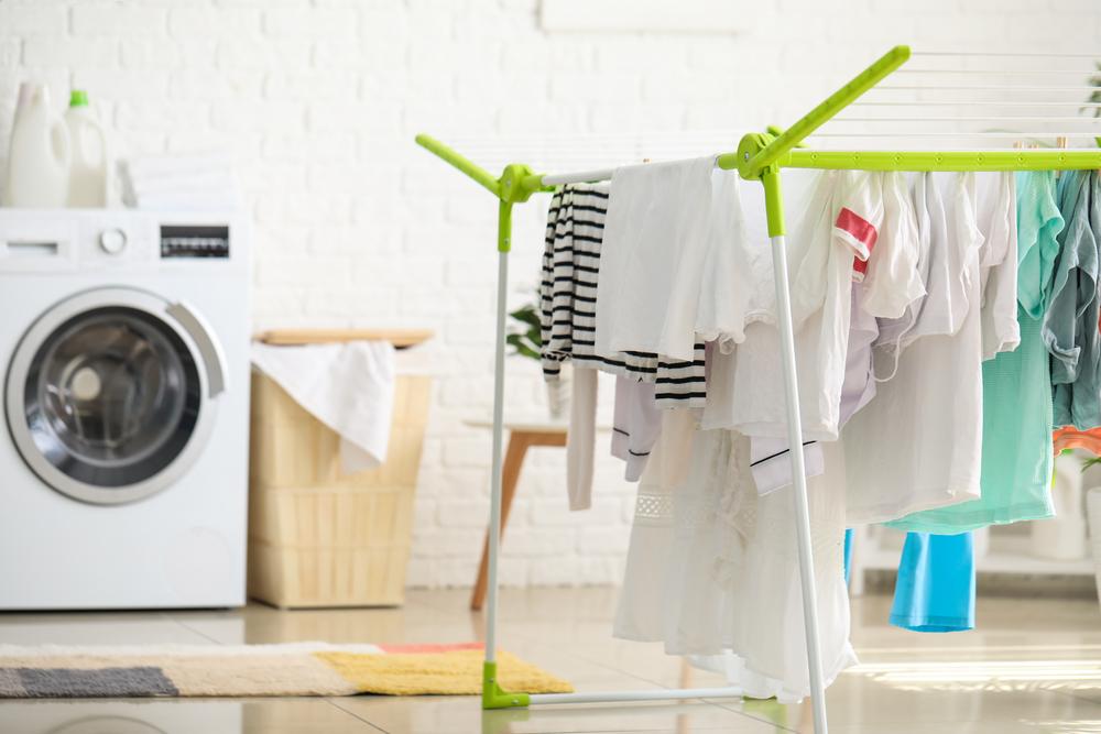 A good collapsible drying rack goes a long way to extend the life of clothes while reducing energy. (Pixel-Shot/Shutterstock)