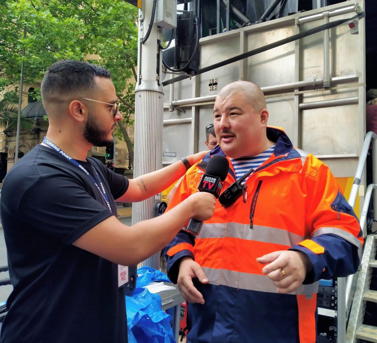 Pro-Kremlin personality Simeon Boikov, known online as the Aussie Cossack, talking to a reporter at a COVID-19 protest on Nov. 20, 2021. (Nina Nguyen/ Epoch Times)
