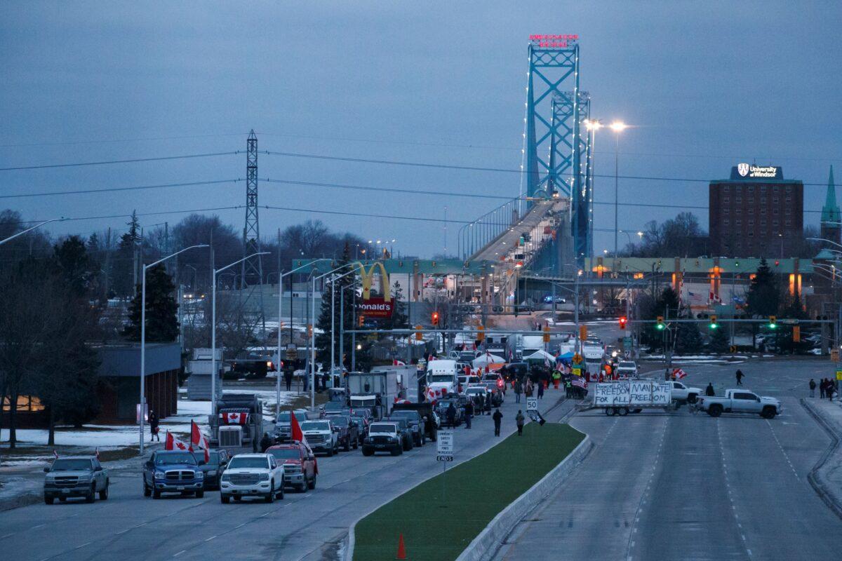 Protestors and supporters at a blockade at the foot of the Ambassador Bridge, sealing off the flow of commercial traffic over the bridge into Canada from Detroit in Windsor, on Feb. 10, 2022. (Cole Burston/Getty Images)