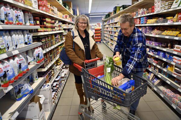 Clients shopping in the Spar supermarket in Helecine, Belgium on March 7, 2022. (Eric Lalmand/Belga Mag/AFP via Getty Images)