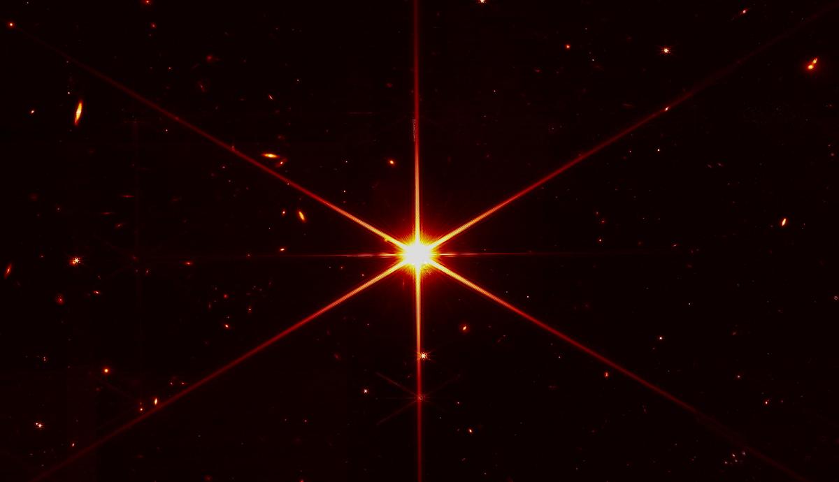 Space Telescope’s Image of Star Gets Photobombed by Galaxies
