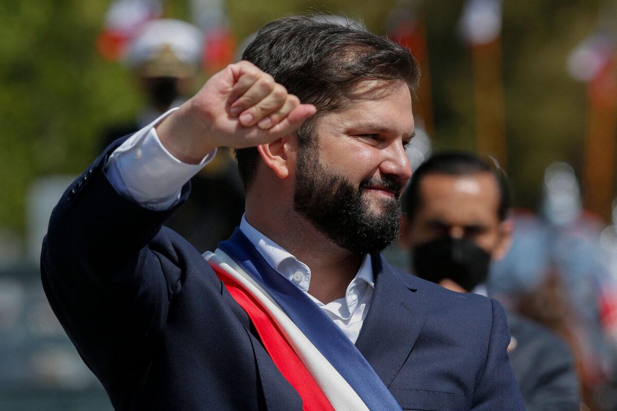Chile’s President Gabriel Boric greets his supporters while leaving the Congress after his inauguration ceremony in Valparaiso, Chile, on March 11, 2022. (Claudio Reyes/AFP via Getty Images)