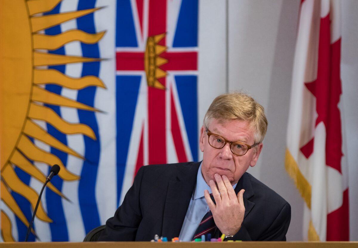 Commissioner Austin Cullen listens to introductions before opening statements at the Cullen Commission of Inquiry into Money Laundering in British Columbia, in Vancouver on Feb. 24, 2020. (The Canadian Press/Darryl Dyck)