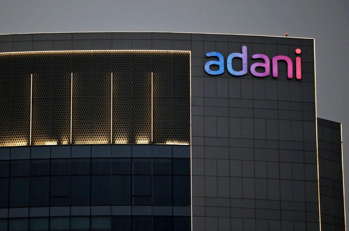 The logo of the Adani Group on the facade of its buildings on the outskirts of Ahmedabad, India, on April 13, 2021. (Amit Dave/Reuters)