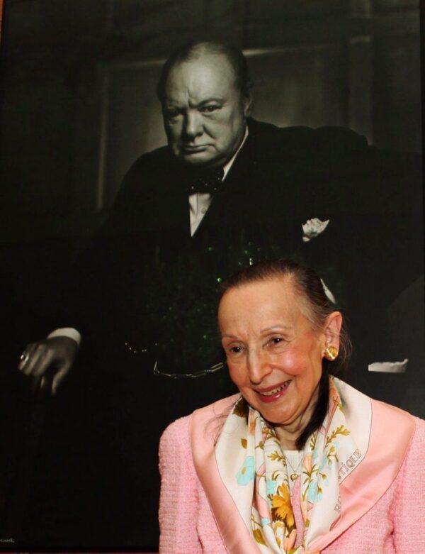 Estrellita Karsh, wife of legendary photographer Yousuf Karsh, stands in front of the iconic 1941 photograph of Winston Churchill taken by her husband in the Speaker of the House of Commons' chambers, on July 14, 2009. (The Canadian Press/Fred Chartrand)