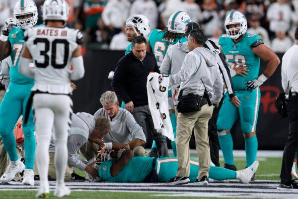 Miami Dolphins quarterback Tua Tagovailoa is examined during the first half of the team's NFL football game against the Cincinnati Bengals in Cincinnati on Sept. 29, 2022. (Jeff Dean/AP Photo)