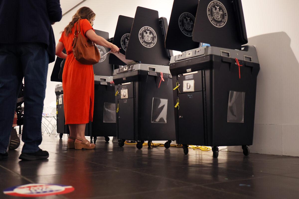 A woman casts her ballot in New York City on June 28, 2022. (Michael M. Santiago/Getty Images)