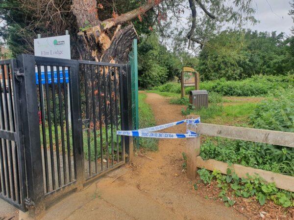 Police tape seals off the towpath close to where Lee Peacock was arrested in Greenford, west London, on Aug. 25, 2021. (Chris Summers/The Epoch Times)