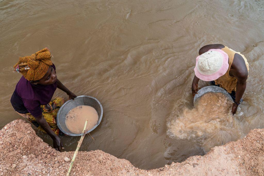 Artisanal miners collect gravel from the Lukushi river searching for cassiterite in Manono, in Congo, on Feb. 17, 2022. (Junior Kannah/AFP via Getty Images)
