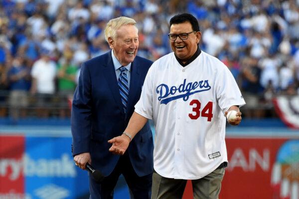 Former Los Angeles Dodgers broadcaster Vin Scully talks with former Los Angeles Dodgers player Fernando Valenzuela prior to the ceremonial first pitch before game two of the 2017 World Series between the Houston Astros and the Los Angeles Dodgers at Dodger Stadium in Los Angeles on Oct. 25, 2017. (Jayne Kamin-Oncea/Pool/Getty Images)