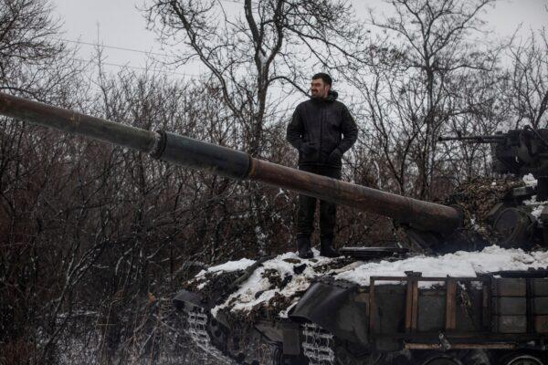 A Ukrainian serviceman stands on a tank outside the frontline town of Bakhmut, amid Russia's attack on Ukraine, in Donetsk region, Ukraine, on Feb. 14, 2023. (Yevhenii Zavhorodnii/Reuters)