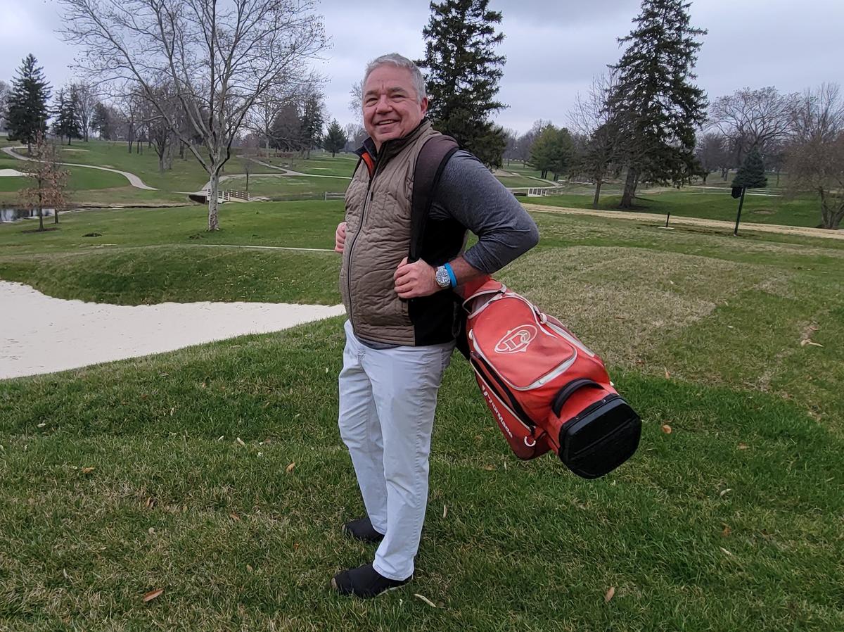 Dr. Chuck Stone, 63, a retired dentist, poses near a bunker at his favorite golf course. A life-long golfer, he credits golf for helping him to stay healthy and enjoy great times with friends. Decatur, Ill.<br/>March 27, 2023.