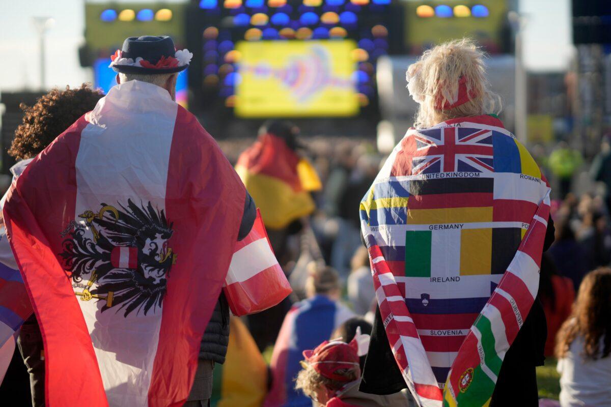 Music fans dance and watch the Eurovision Song Contest Semi-Final 2 on a giant screen in the Eurovision Village on the riverside in Liverpool, England, on May 11, 2023. (Christopher Furlong/Getty Images)