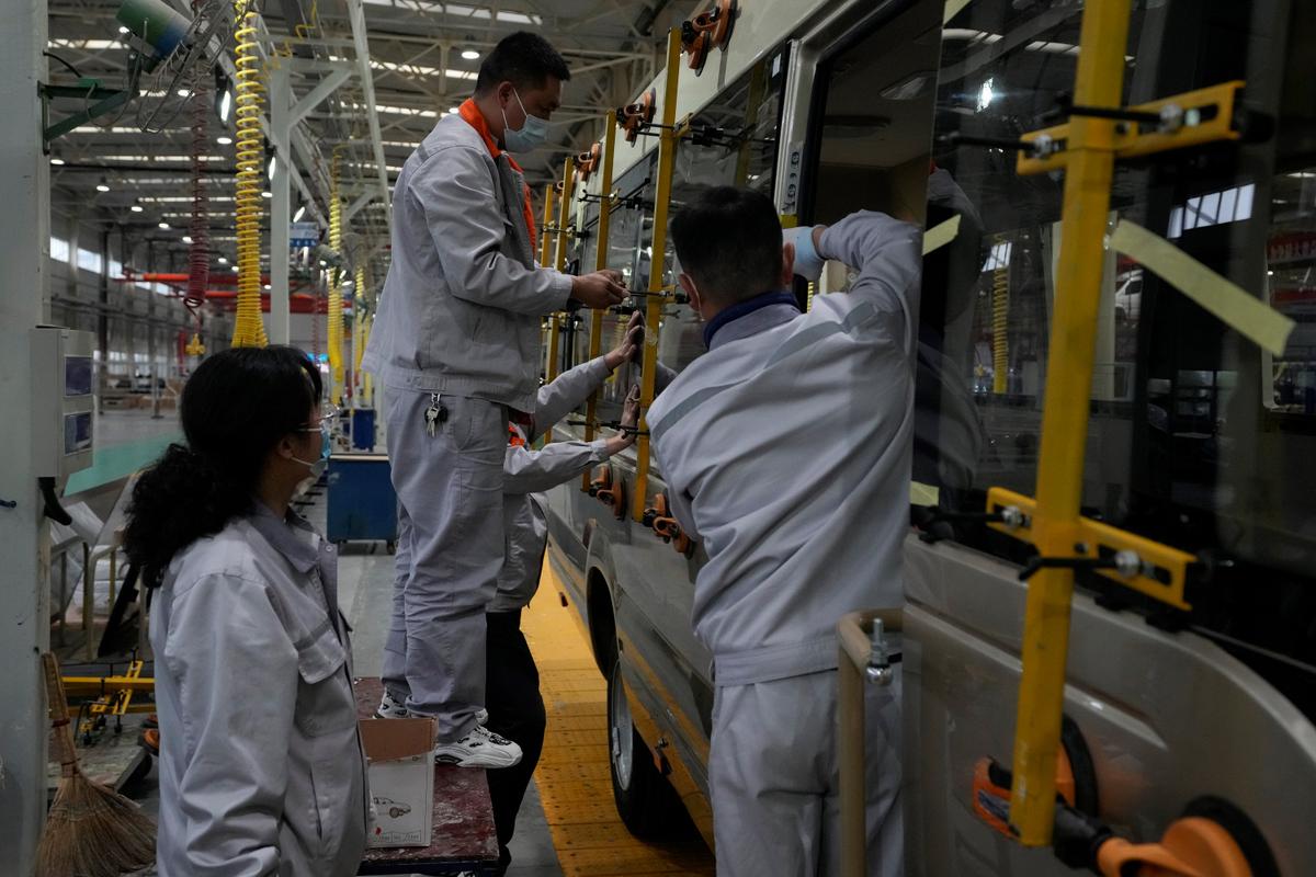 China Factory Activity Slows, Adding to Economic Strains