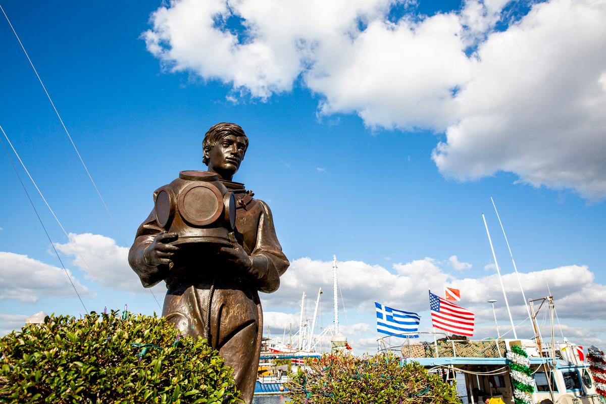 A statue near the historic sponge docks of Tarpon Springs, Fla., pays homage to all of the sponge divers who've made their living in the town's industry, on Dec. 19, 2020. (Patrick Connolly/Orlando Sentinel/TNS)