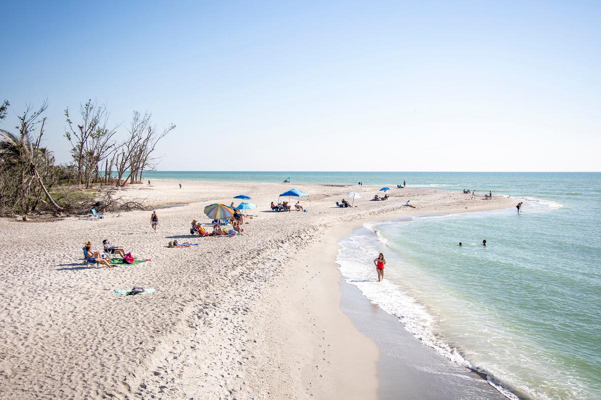 Beachgoers take in some sun at Blind Pass Beach on Sanibel Island on March 1, 2023. (Patrick Connolly/Orlando Sentinel/TNS)