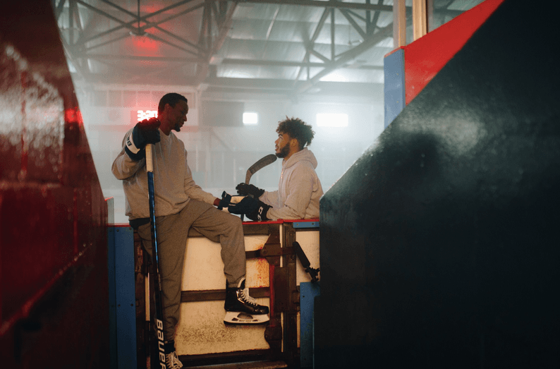 Former NFL player Wayne Simmonds (L) and an up-and-coming young goalie in "Black Ice." (Roadside Attractions)