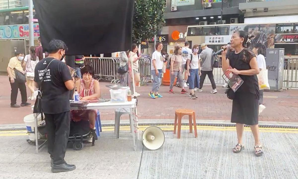 Hong Kong Civic Group Defies Suppression by Setting up Street Booth and Hoisting Black Cloth to Avoid Prosecution