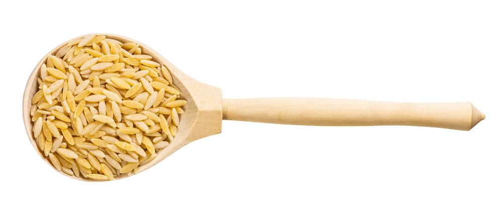 Petite orzo pasta allows the tomatoes and greens to shine as they should. (vvoe/Shutterstock)
