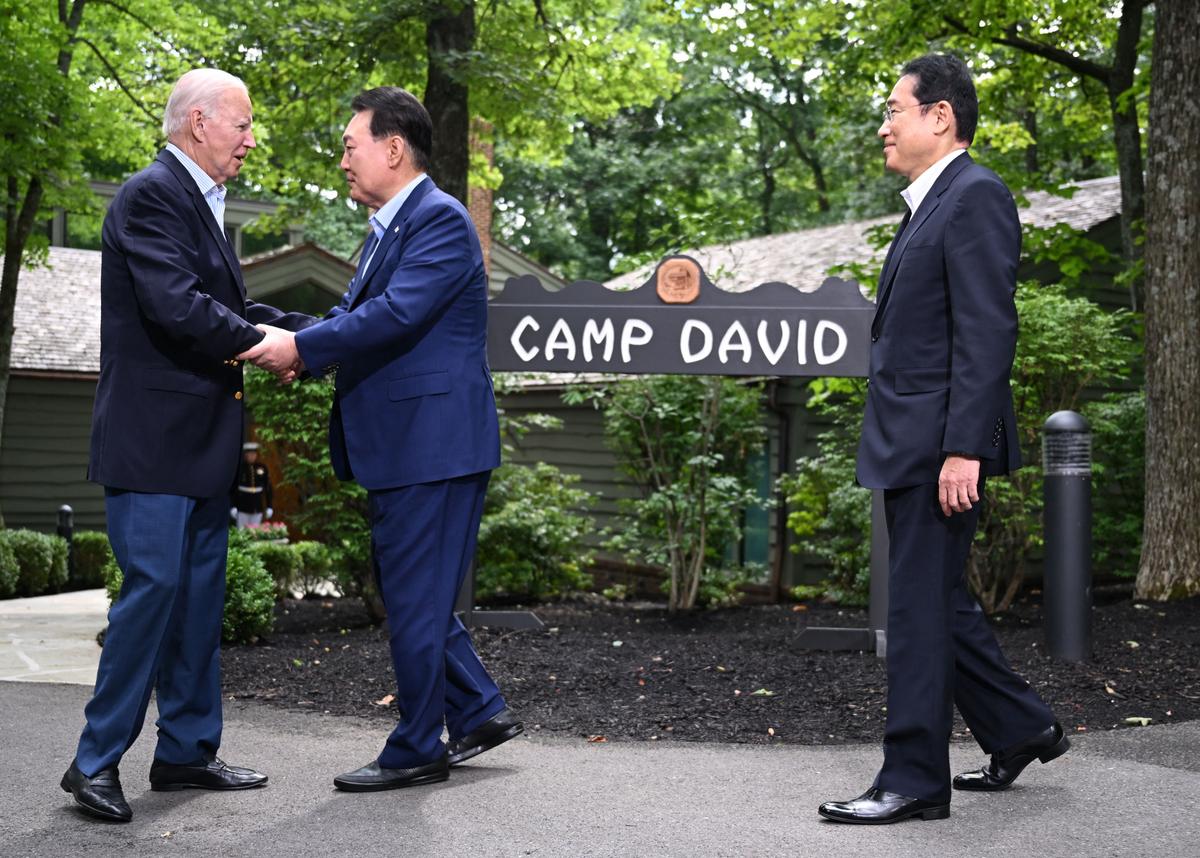 Biden Convenes First-Ever Trilateral Summit With Japan, Korea Amid China Threats