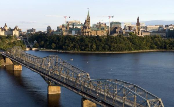 The Parliament Buildings are seen over the Alexandra Bridge in Ottawa on Sept.7, 2022. (The Canadian Press/Adrian Wyld)