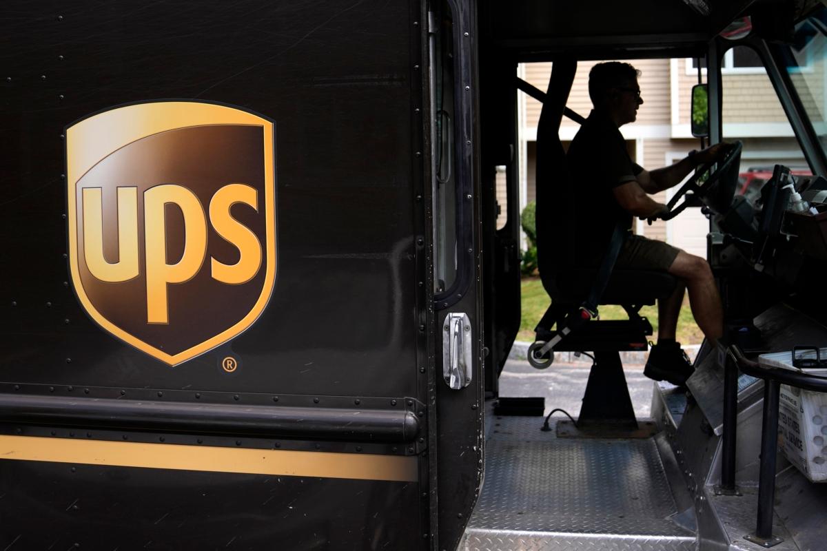 A United Parcel Service driver steers through a neighborhood while delivering packages in Haverhill, Mass., in this file photo. (Charles Krupa/AP Photo)