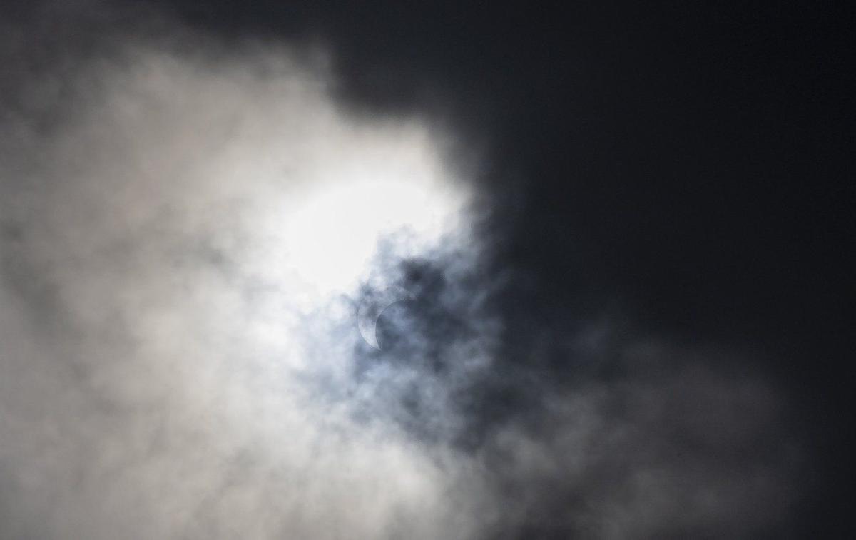 Cloud Breaks Bring Cheers From Partial Solar Eclipse Watchers at BC Observatory