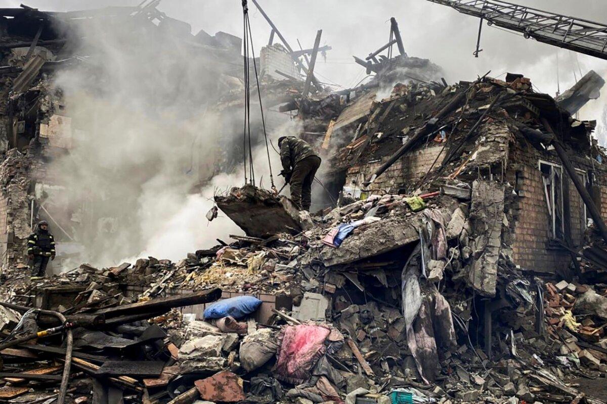 Rescuers work at the scene of a building damaged by shelling in Novohrodivka, Ukraine, on Nov. 30, 2023. (Ihor Moroz, Head of the Donetsk Regional Military Administration via AP)
