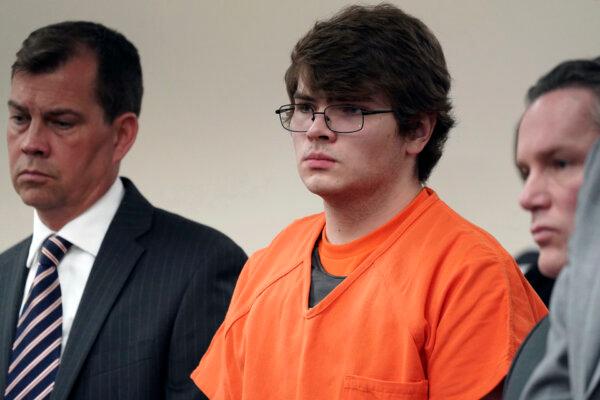 Payton Gendron (C) listens as he is sentenced to life in prison without parole for domestic terrorism motivated by hate and each of the 10 counts of first-degree murder in an Erie County courtroom in Buffalo, N.Y., on Feb. 15, 2023. (Derek Gee/The Buffalo News via AP)