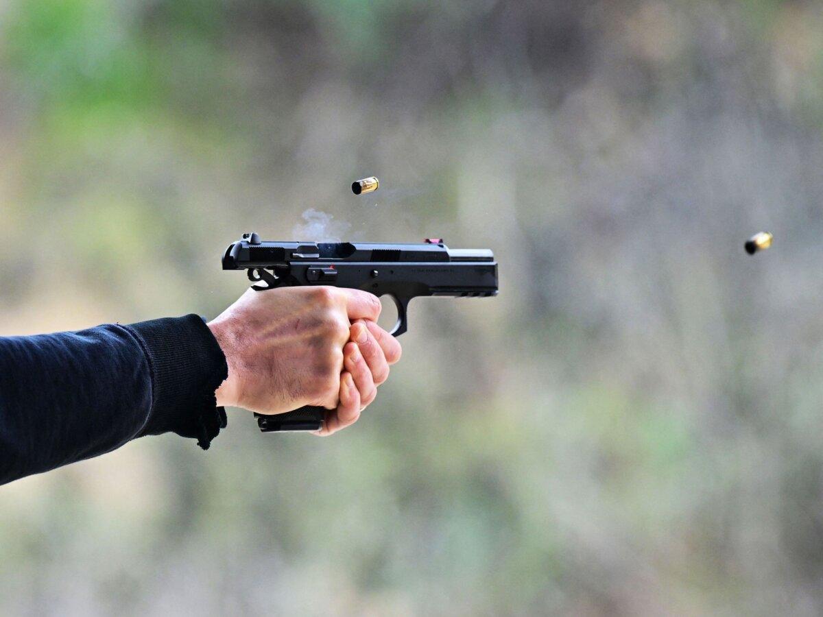 A man fires a pistol during a Defensive Pistol Class at Burro Canyon Shooting Park in Azusa, Calif., on Feb. 12, 2023. (Frederic J. Brown/AFP via Getty Images)