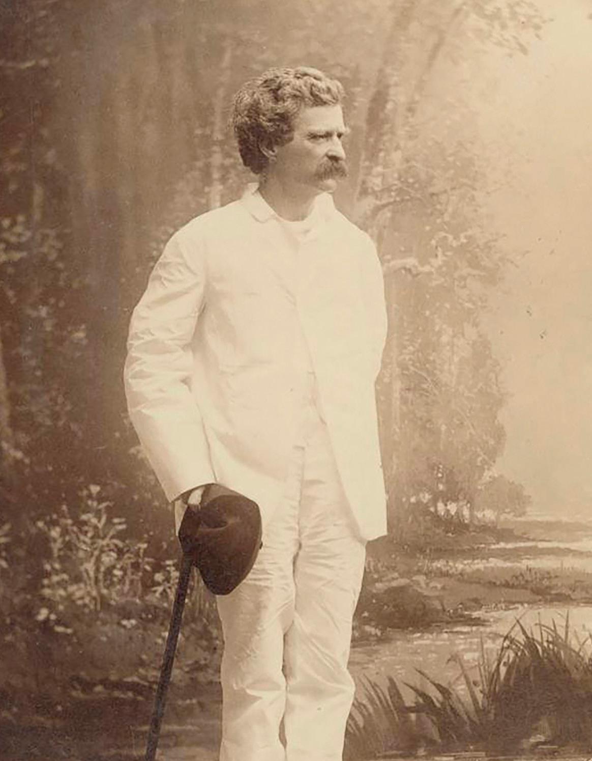 Twain by the riverside, photographed by Benjamin J. Falk, circa late 19th century. (Public Domain)
